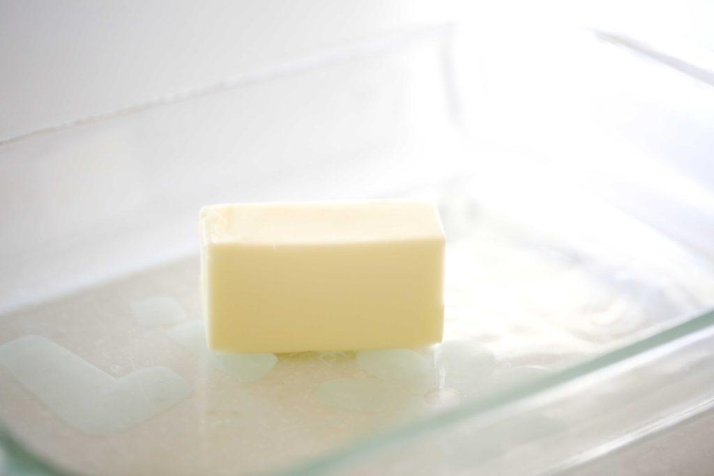 Preheat oven to 350 degrees F. Put 1/2 cup butter in 13 x 9 inch baking pan, and place in oven to melt as it preheats. Watch carefully that it doesn’t burn.