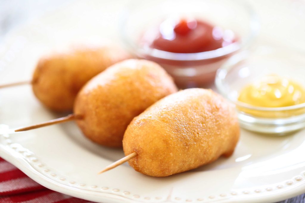 homemade carnival style mini-corn dogs with ketchup and mustard