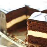 Homemade chocolate cake with cream filling and chocolate ganache topping